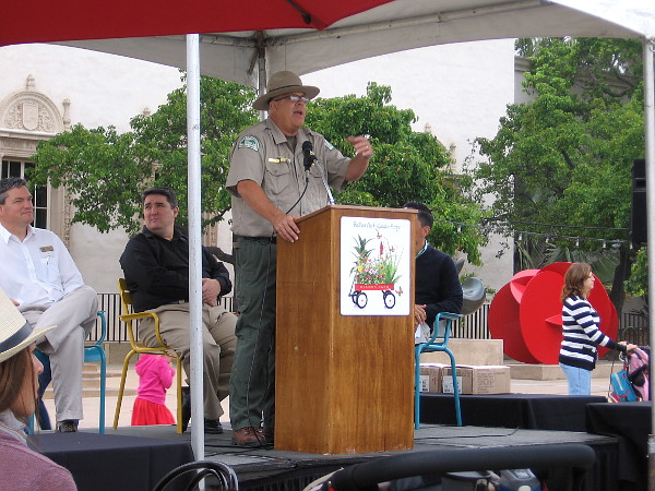 Balboa Park's Ranger Kim greets Garden Party visitors and introduces several notable speakers.